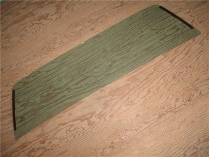 Picture of rear window glass, green tinted, with defrost element